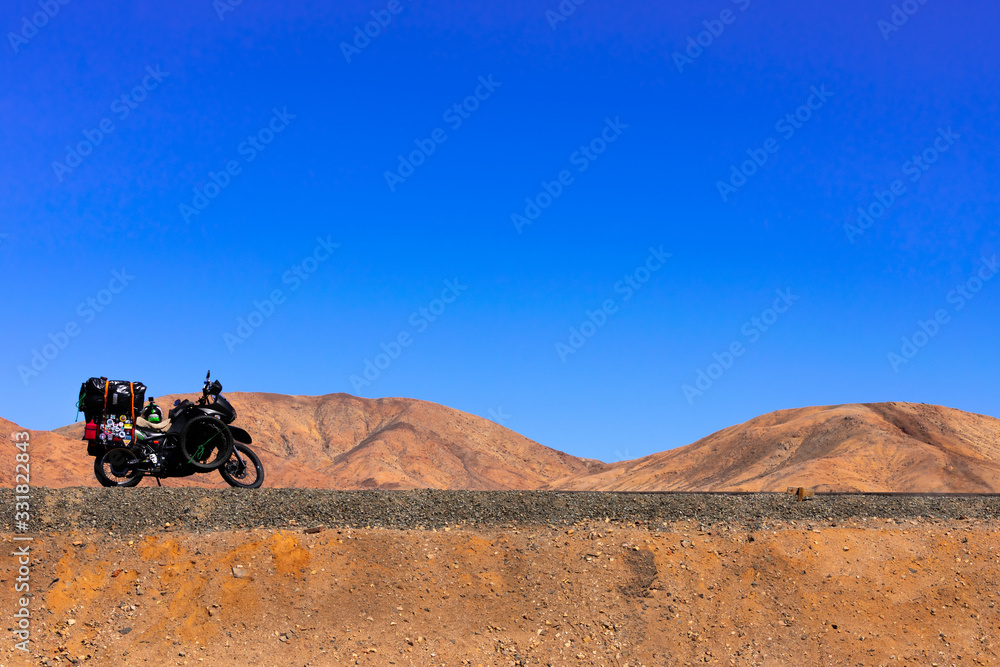 Motorbike on the Pan American route in the Atacama desert of Chile Motorbike on the Pan American route in the Atacama desert of Chile