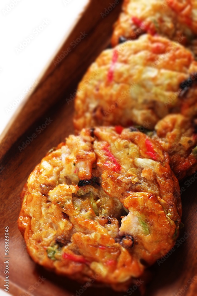 Japanese food, vegetable fish cake on wooden plate Japanese food, vegetable fish cake on wooden plate