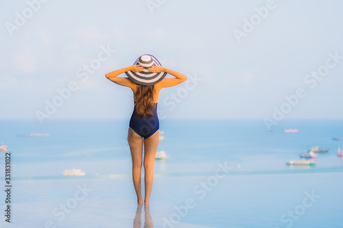 Portrait beautiful young asian woman relax around swimming pool in hotel resort © siraphol