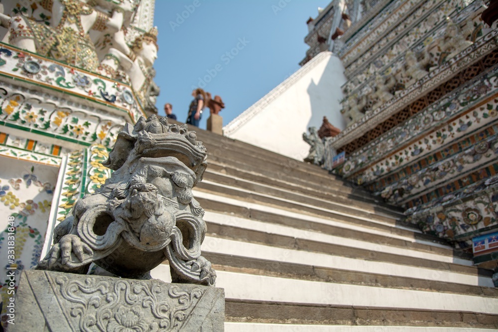 Obraz premium Bangkok, Thailand - February 2, 2020, Thailand beautiful iconic decorated by ceramics and porcelains, Wat Aroon (The Temple of Dawn)