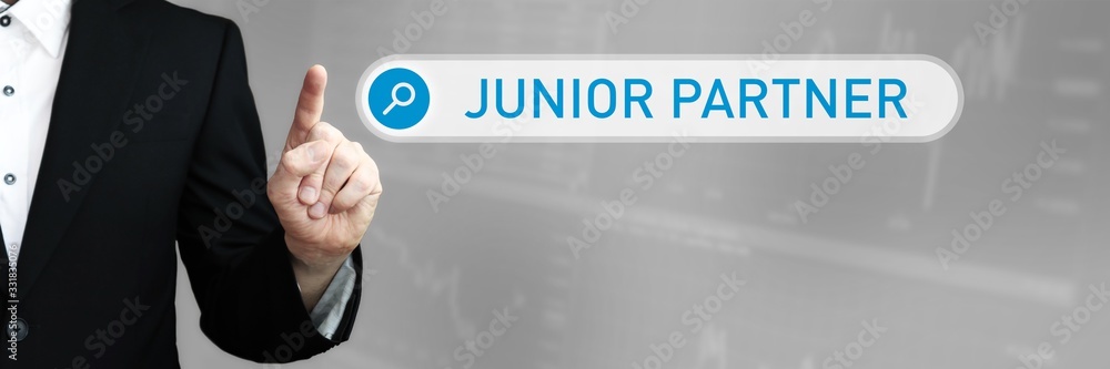 Junior Partner. Man in a suit points a finger at a search box. The word Junior Partner is in the search. Symbol for business, finance, statistics, analysis, economy Junior Partner. Man in a suit points a finger at a search box. The word Junior Partner is in the search. Symbol for business, finance, statistics, analysis, economy