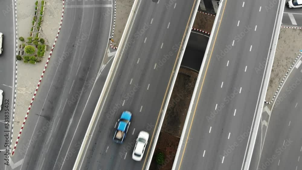 Aerial view city transport junction croos road with car movement day time Aerial view city transport junction croos road with car movement day time