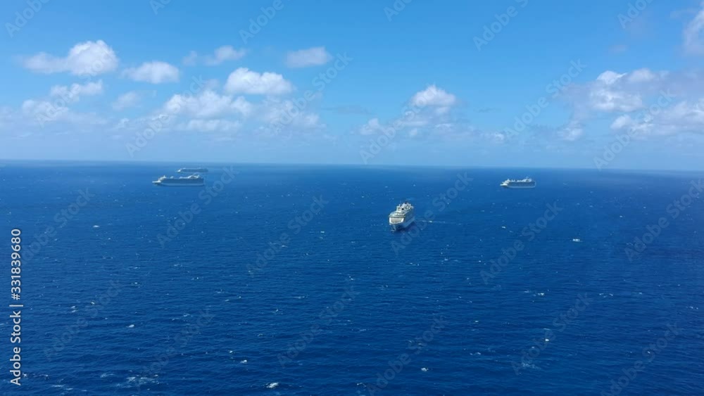 Bimini, Bahamas - March 19, 2020: aerial view on the cruise ships on quarantine at the ocean at sunny weather Bimini, Bahamas - March 19, 2020: aerial view on the cruise ships on quarantine at the ocean at sunny weather