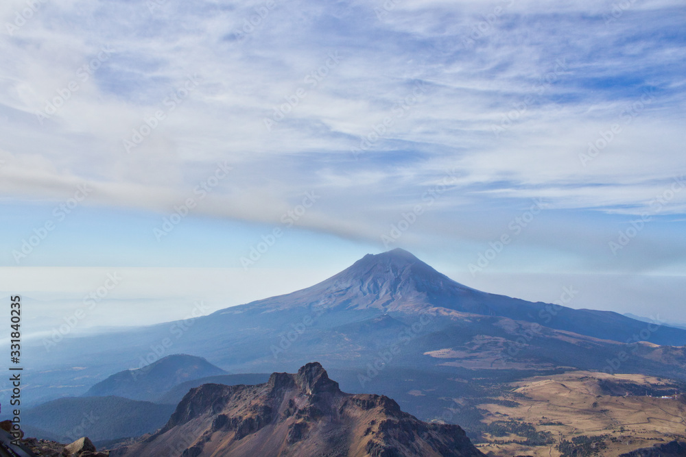 Iztaccihuatl volcano to experience the high attitude and see the active Popocatepetl