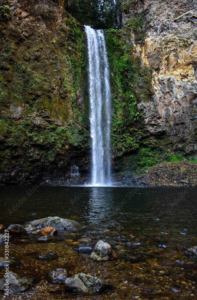 Cascada La Gloria This waterfall, which slides down a stone wall amid the lush greenery of the mountains Cascada La Gloria This waterfall, which slides down a stone wall amid the lush greenery of the mountains