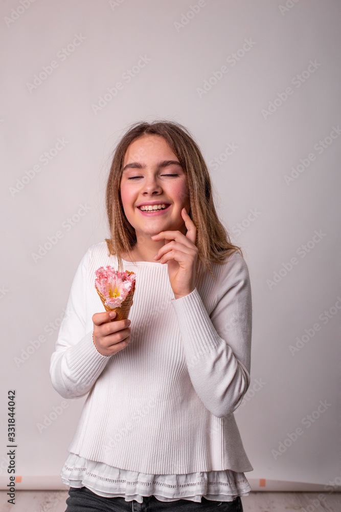 vertical portrait of a laughing teenager girl on a white background vertical portrait of a laughing teenager girl on a white background