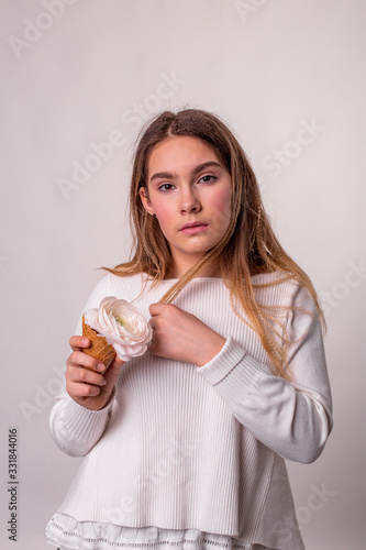 vertical portrait of a pretty teenager girl on a white background