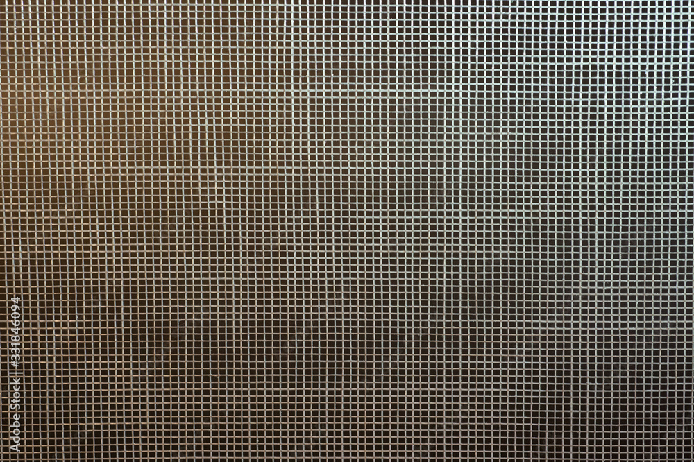 Mosquito net texture closeup shot on a dark background. Background to protect the premises from insects. Abstraction. Mosquito net texture closeup shot on a dark background. Background to protect the premises from insects. Abstraction.
