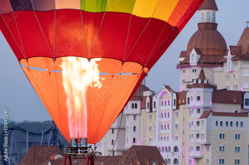 Balloon. Fire. Air. Filling with warmth. Climbing up. photo