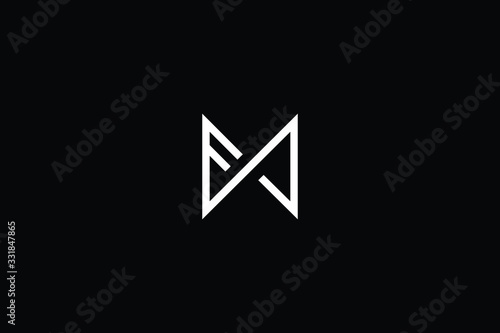 Minimal elegant monogram art logo. Outstanding professional trendy awesome artistic FM MF FW WF initial based Alphabet icon logo. Premium Business logo White color on black background