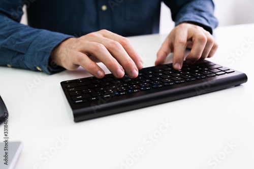 Person's Hand Using Computer Keyboard