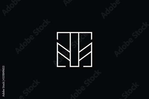 Minimal elegant monogram art logo. Outstanding professional trendy awesome artistic MT TM initial based Alphabet icon logo. Premium Business logo White color on black background