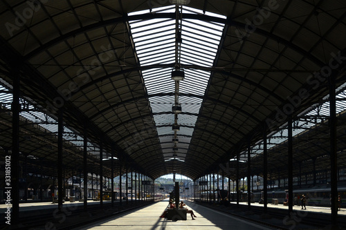 Switzerland train Station with silhouette of passenger that waiting their train.