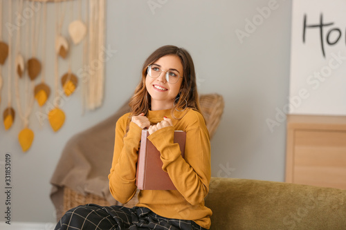 Young woman with stylish ey...