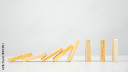 Domino falling on white background