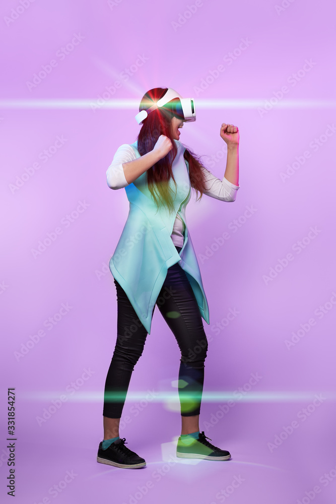 Fototapeta premium Woman is using virtual reality headset.