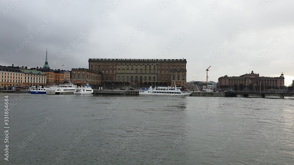 Fototapeta premium Sea bay on the background of the city and cloudy sky. Spring. Stockholm. Sweden.