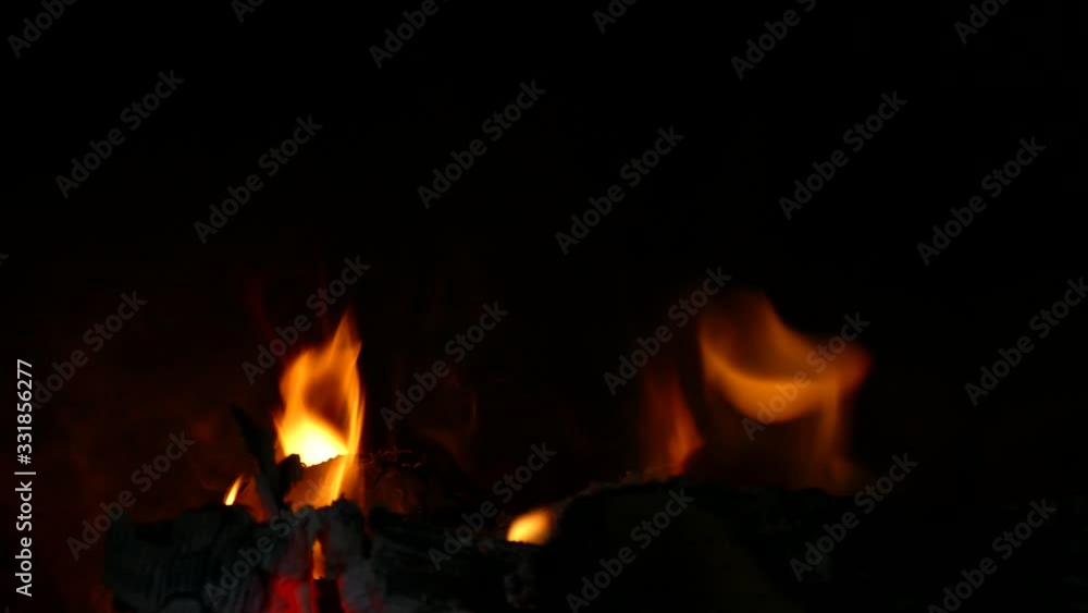 burning firewood in a fireplace burning firewood in a fireplace
