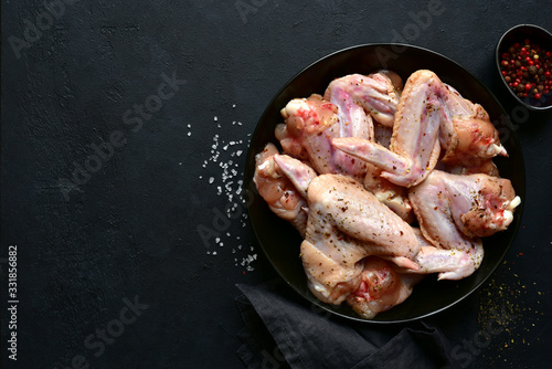 Raw marinated chicken wings. Top view with copy space.