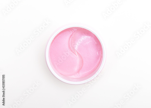 Pink Under eye patches with collagen on white background. Flat lay.