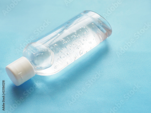 Antibacterial hand gel, sanitizer on a blue background. A means of protection against viruses.