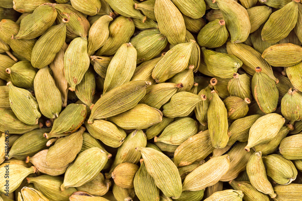 A background of green cardamon pods A background of green cardamon pods