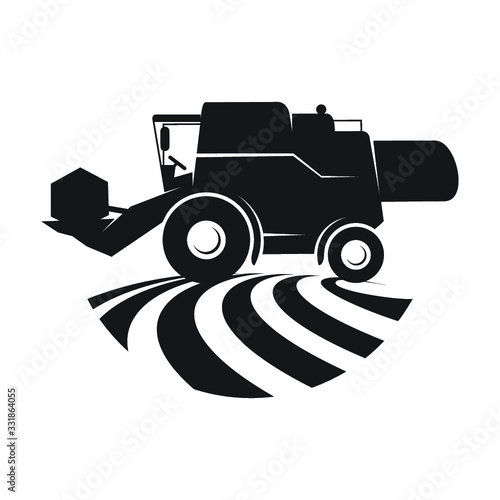 Combine harvester in a field