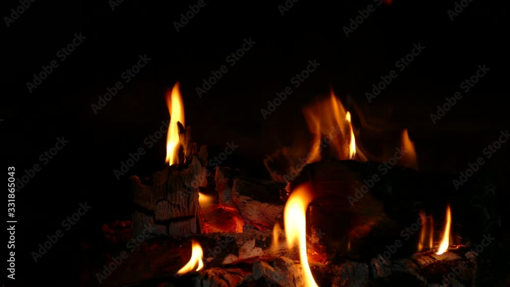 burning firewood in a fireplace burning firewood in a fireplace