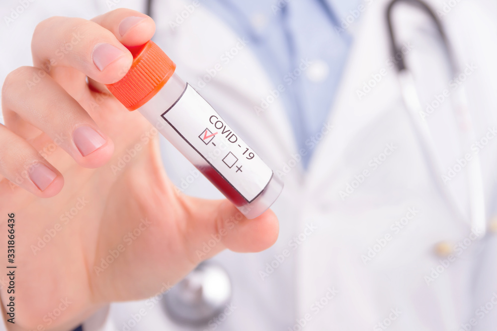 Closeup doctor hand in medical gloves is holding test tube with blood analysis. SARS-CoV-2, 2019-nCoV negative test. Virus that leads to infectious disease Covid-19. Coronavirus pandemic concept. Closeup doctor hand in medical gloves is holding test tube with blood analysis. SARS-CoV-2, 2019-nCoV negative test. Virus that leads to infectious disease Covid-19. Coronavirus pandemic concept.