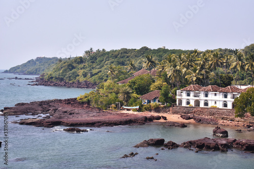 image of the ocean with vast greenery just beside it, in Dona paula