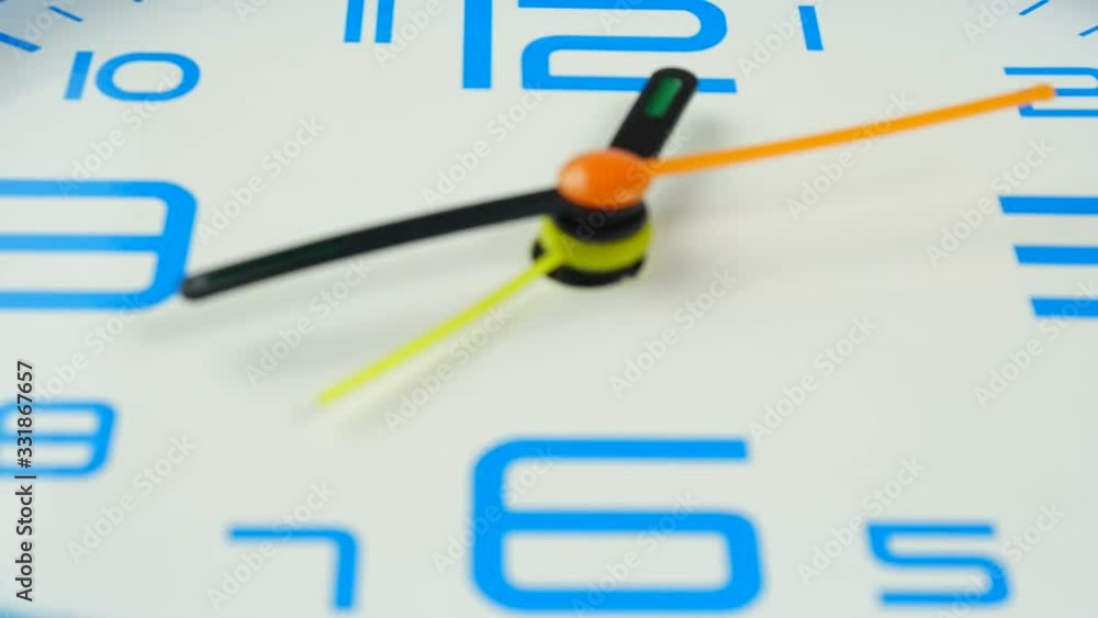 Blue Alarm clock face beginning of time 12.35 am or pm. on white background. Blue Alarm clock face beginning of time 12.35 am or pm. on white background.