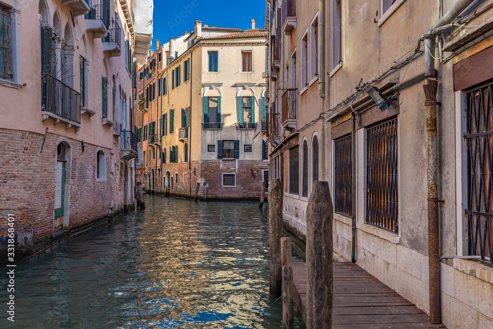 Gondola to parking in narrow canal, Venice. Italy landscape