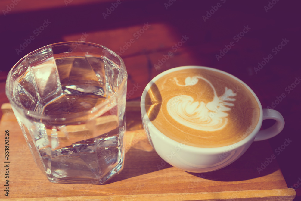 hot latte art coffee on wood table, relax time hot latte art coffee on wood table, relax time