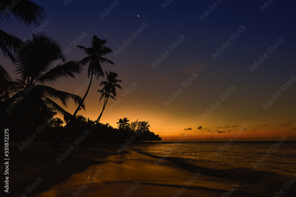 Sunset on the beach. Paradise beach. Tropical paradise.