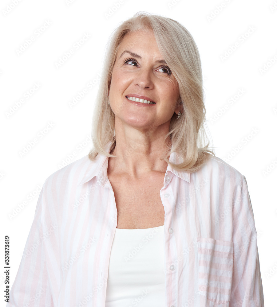Smiling senior woman with long hair is looking up. Isolated Smiling senior woman with long hair is looking up. Isolated