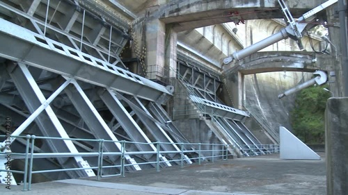 tainter gate from river hydroelectric dam photo