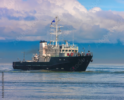  small ship at blue sea near the coast