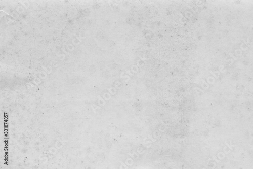 Cardboard white texture close-up. Light old paper background. Grunge concrete wall. Vintage blank wallpaper.