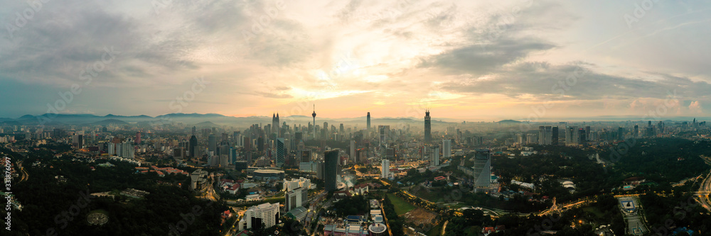 Panorama cityscape view in the middle of Kuala Lumpur city center during sunrise. Kuala Lumpur, MALAYSIA