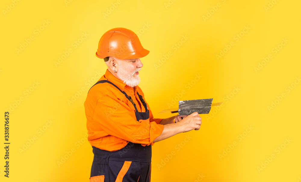 He needs little break. Plasterer in working uniform plastering. man with spatula. process of applying layer of putty. Plastering tools for plaster. plaster trowel spatula on drywall plasterboard He needs little break. Plasterer in working uniform plastering. man with spatula. process of applying layer of putty. Plastering tools for plaster. plaster trowel spatula on drywall plasterboard