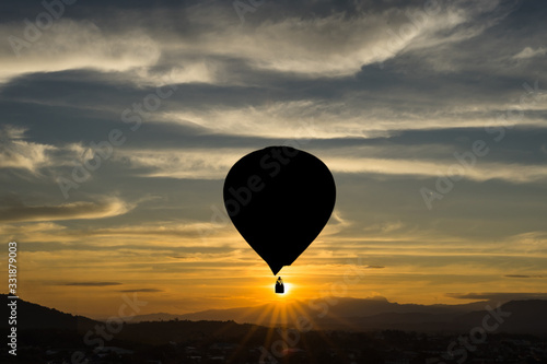 silhouette hot air balloon at sunset