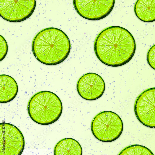 Flat layout green lime slices for summer seasonal concept. Ripe sliced lime on white background.
