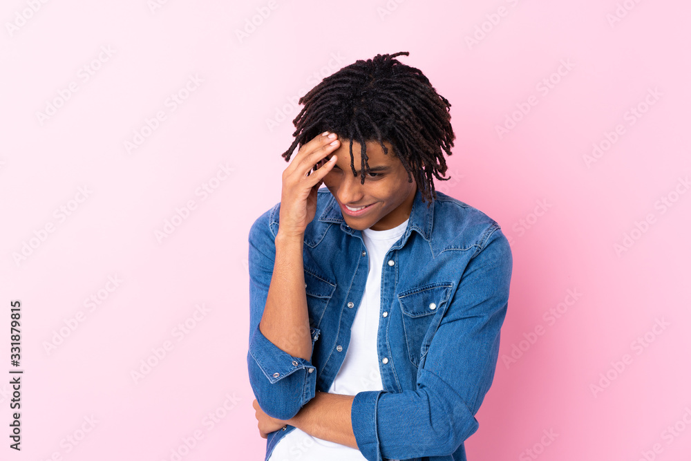 Young African American man with jean shirt over isolated pink background laughing Young African American man with jean shirt over isolated pink background laughing