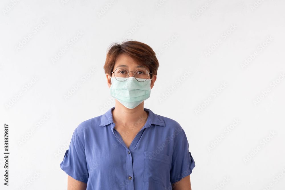 Aseptic medical mask of an Asian woman protected on her face, hands, stopped working without signs Air pollution, viruses, the concept of the spread of the corona virus Aseptic medical mask of an Asian woman protected on her face, hands, stopped working without signs Air pollution, viruses, the concept of the spread of the corona virus