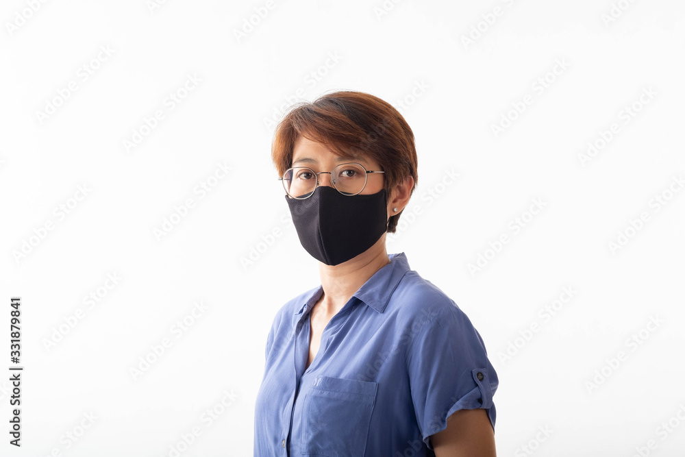 Aseptic medical mask of an Asian woman protected on her face, hands, stopped working without signs Air pollution, viruses, the concept of the spread of the corona virus