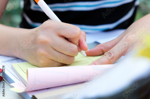 Close up female hands of accountant with calculator and pen. business accounting background. 