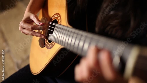 playing twelve steel strings portuguese guitar fado photo