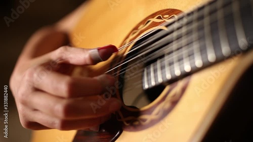 playing twelve steel strings portuguese guitar fado