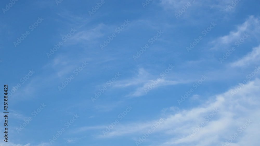 Cirrus thin, white, wispy of clouds are streak across the blue sky Cirrus thin, white, wispy of clouds are streak across the blue sky