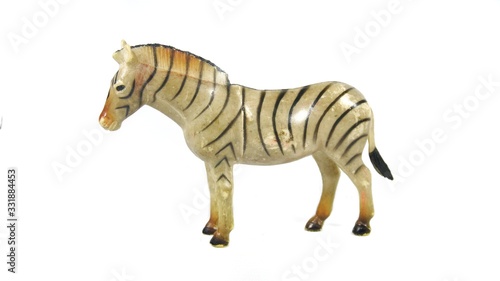 Fototapeta Naklejka Na Ścianę i Meble -  Image of a zebra toy isolated on white background